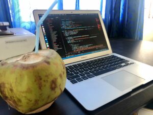 MacBook Air with Coconut on Desk