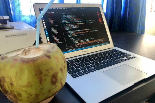 MacBook Air with Coconut on Desk